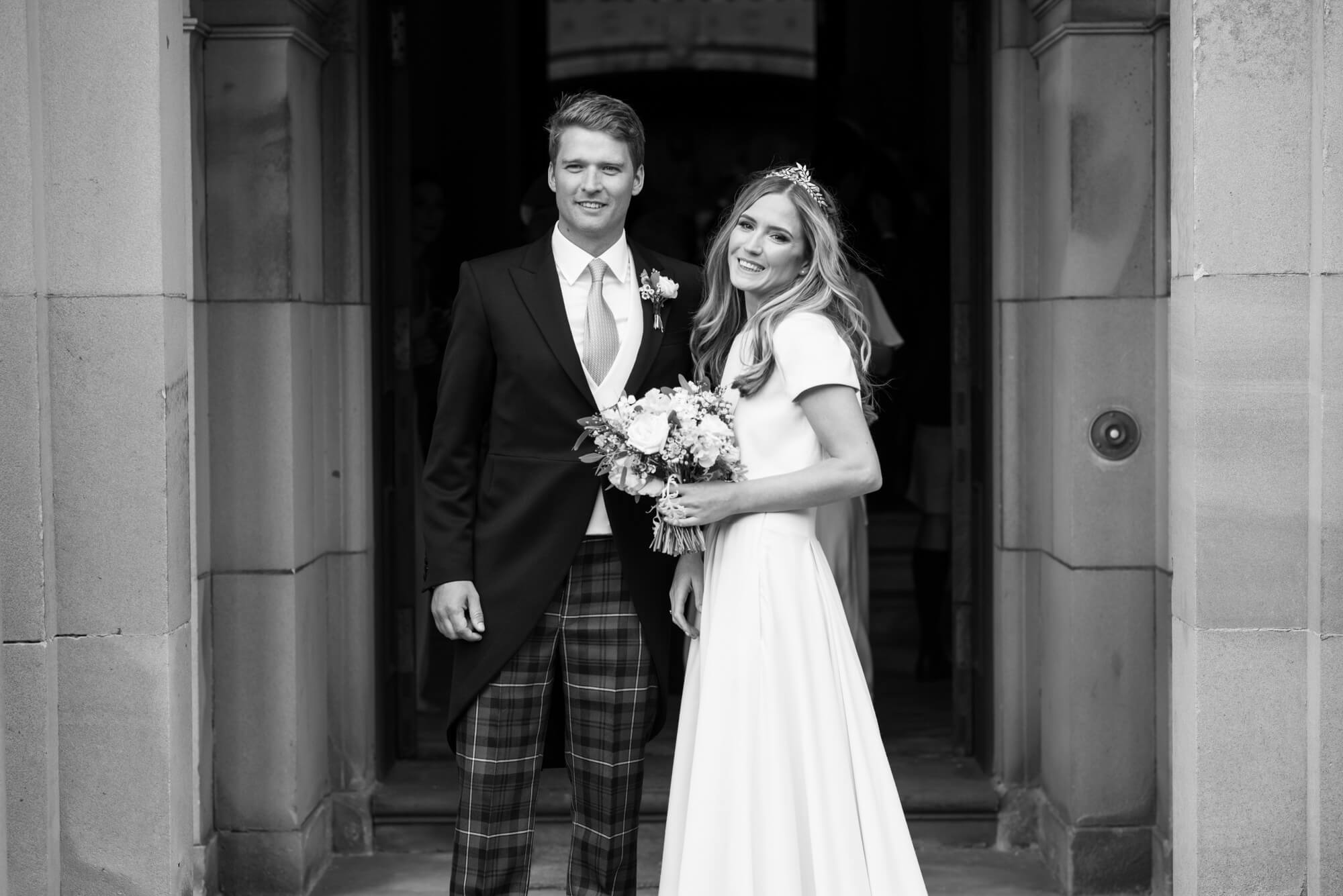 bride and groom at the door of gosford house just before their wedding reception in the marble hall by especially amy wedding photography